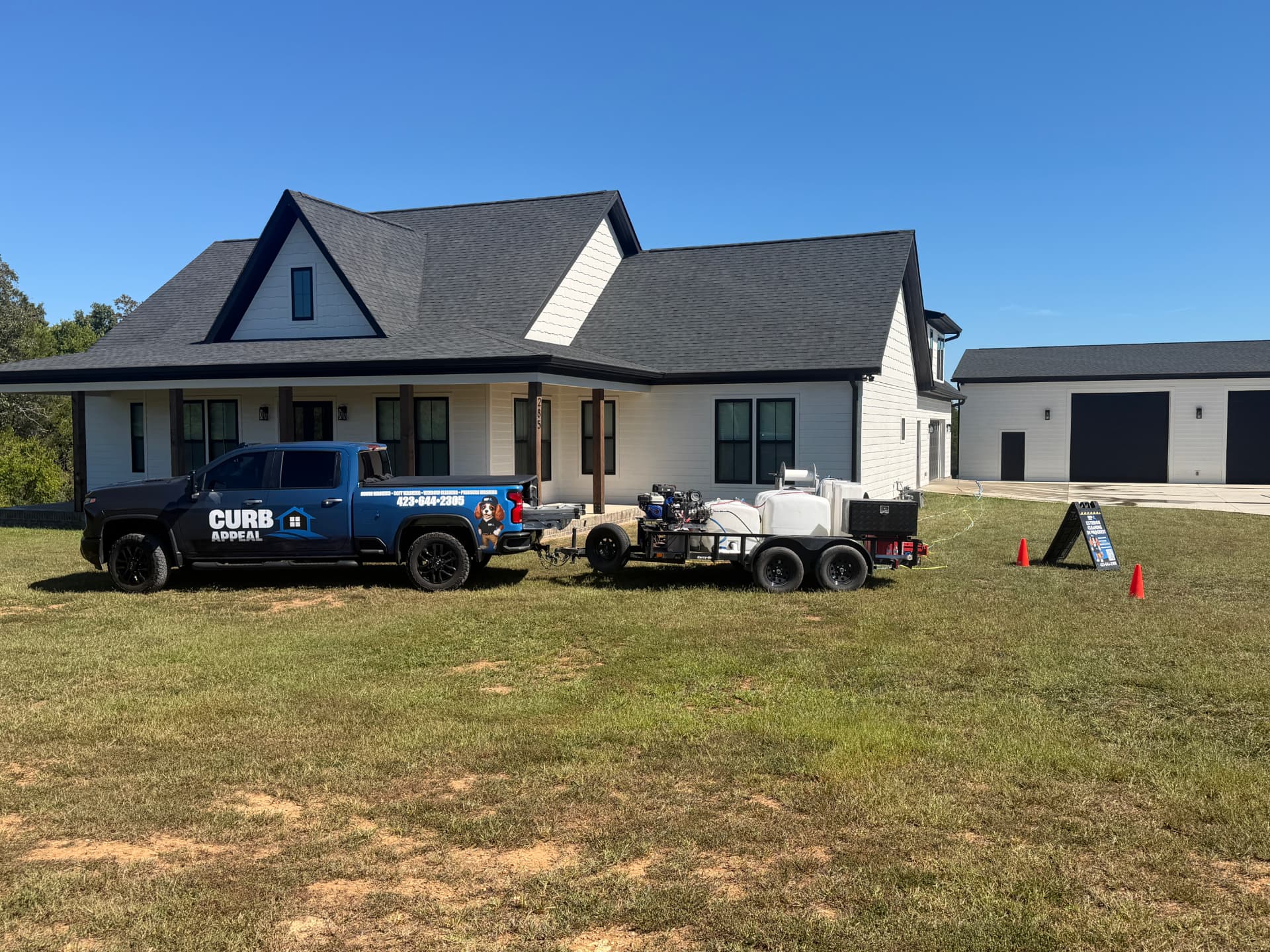 Curb Appeal truck and cleaning trailer